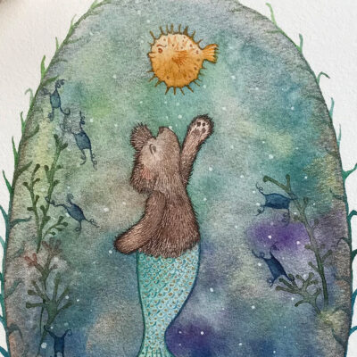 Baxter the Merbear playing with his Puffer Fish