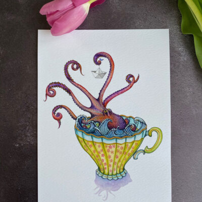 purple kraken holding a paper boat in a vintage teacup